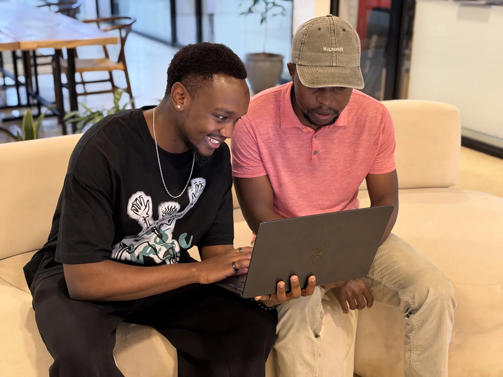 Two Data XL colleagues working through something together on a laptop